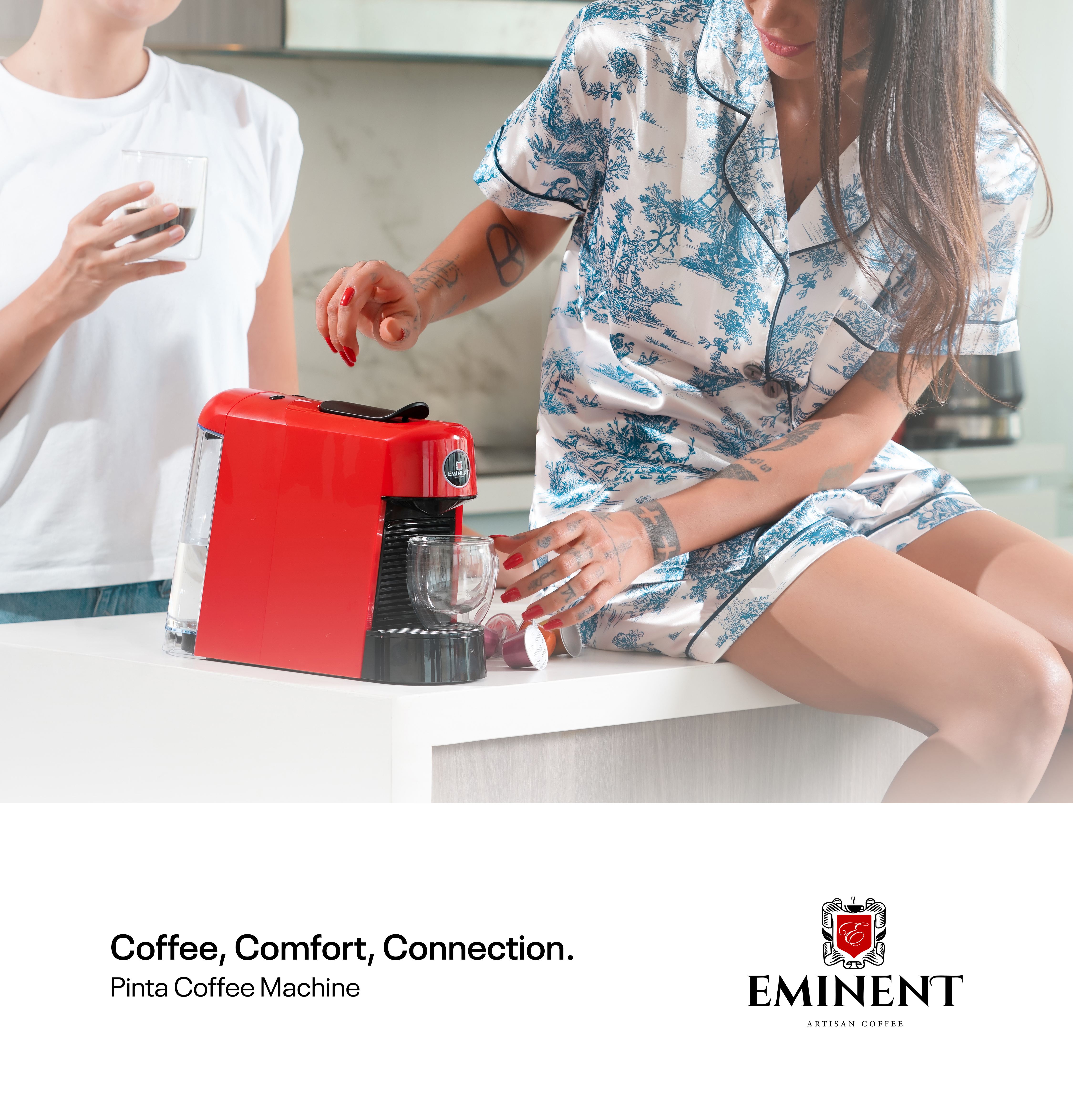 People using a red Eminent Pinta coffee machine.