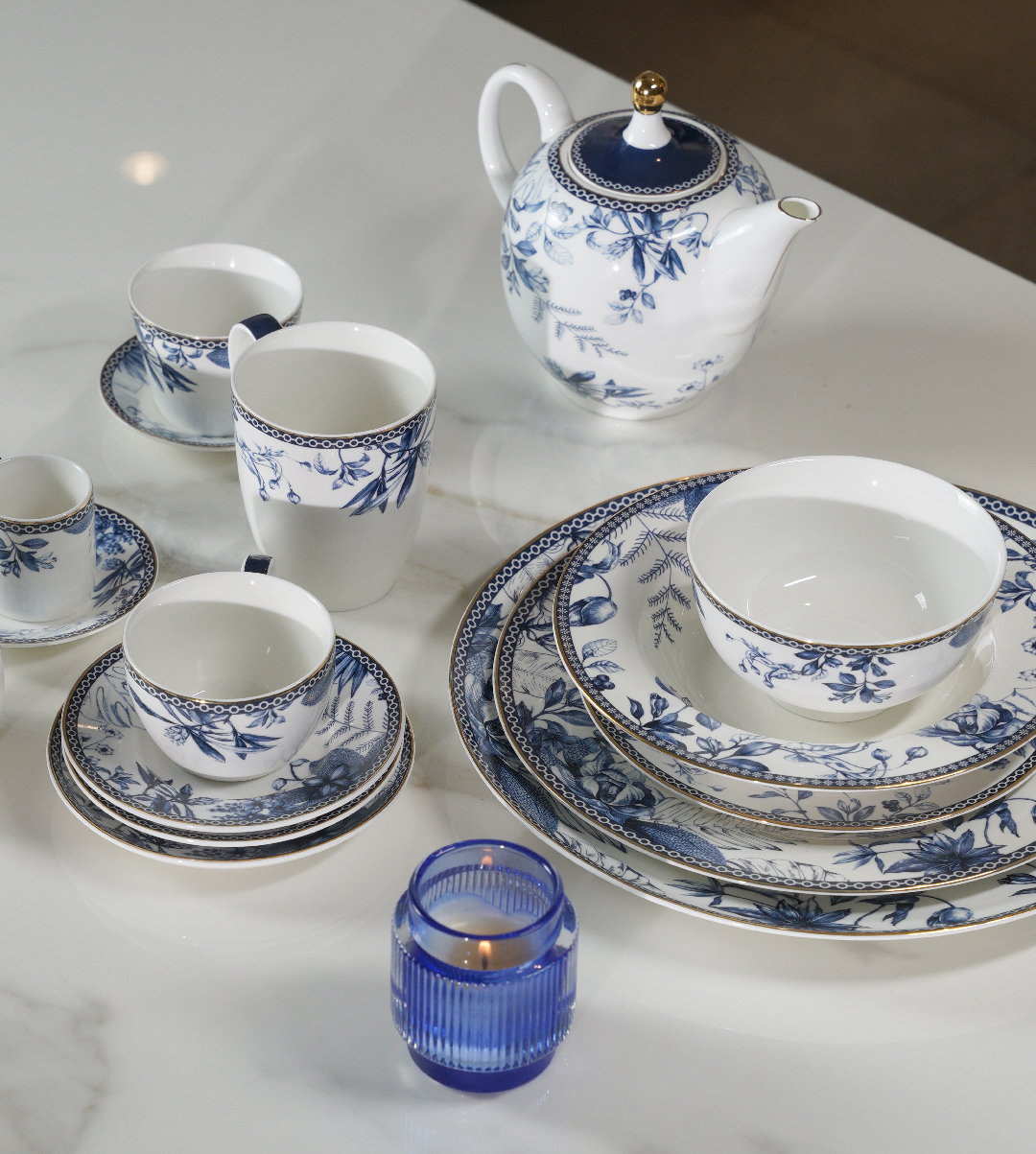 Luhpar Blue Jungle tea set arranged on a table.