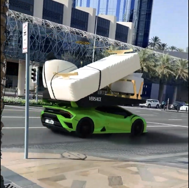 Lamborghini carrying a sofa near Dubai Mall.
