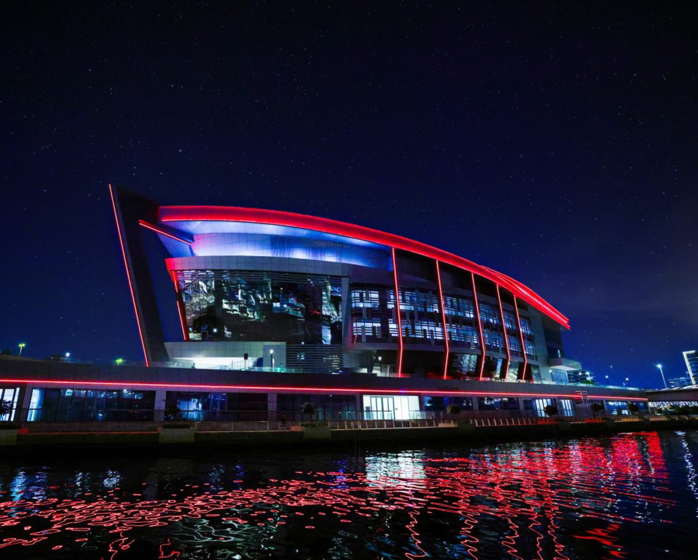 Space42 Arena illuminated at night