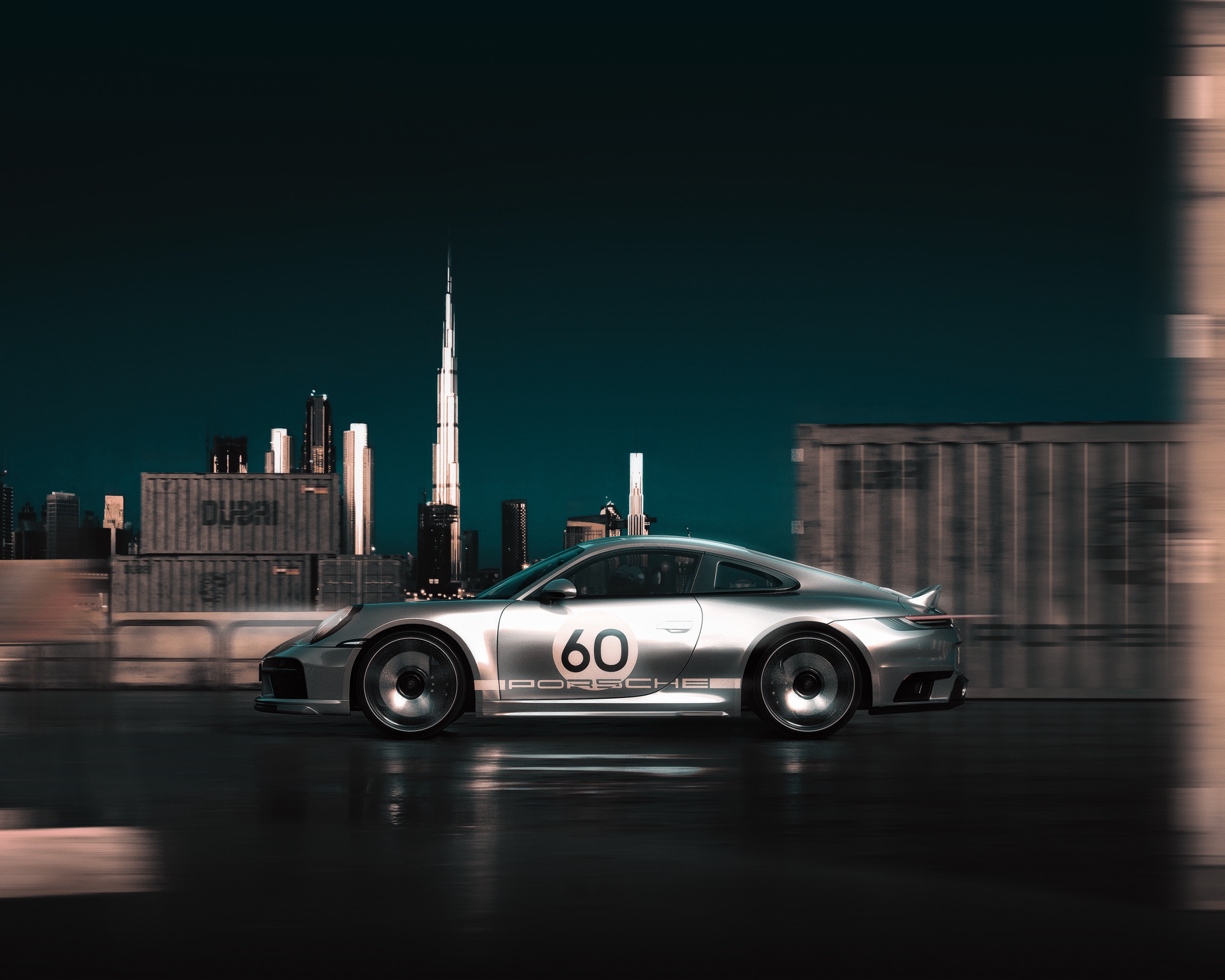 Porsche 911 photographed in motion against the Dubai skyline