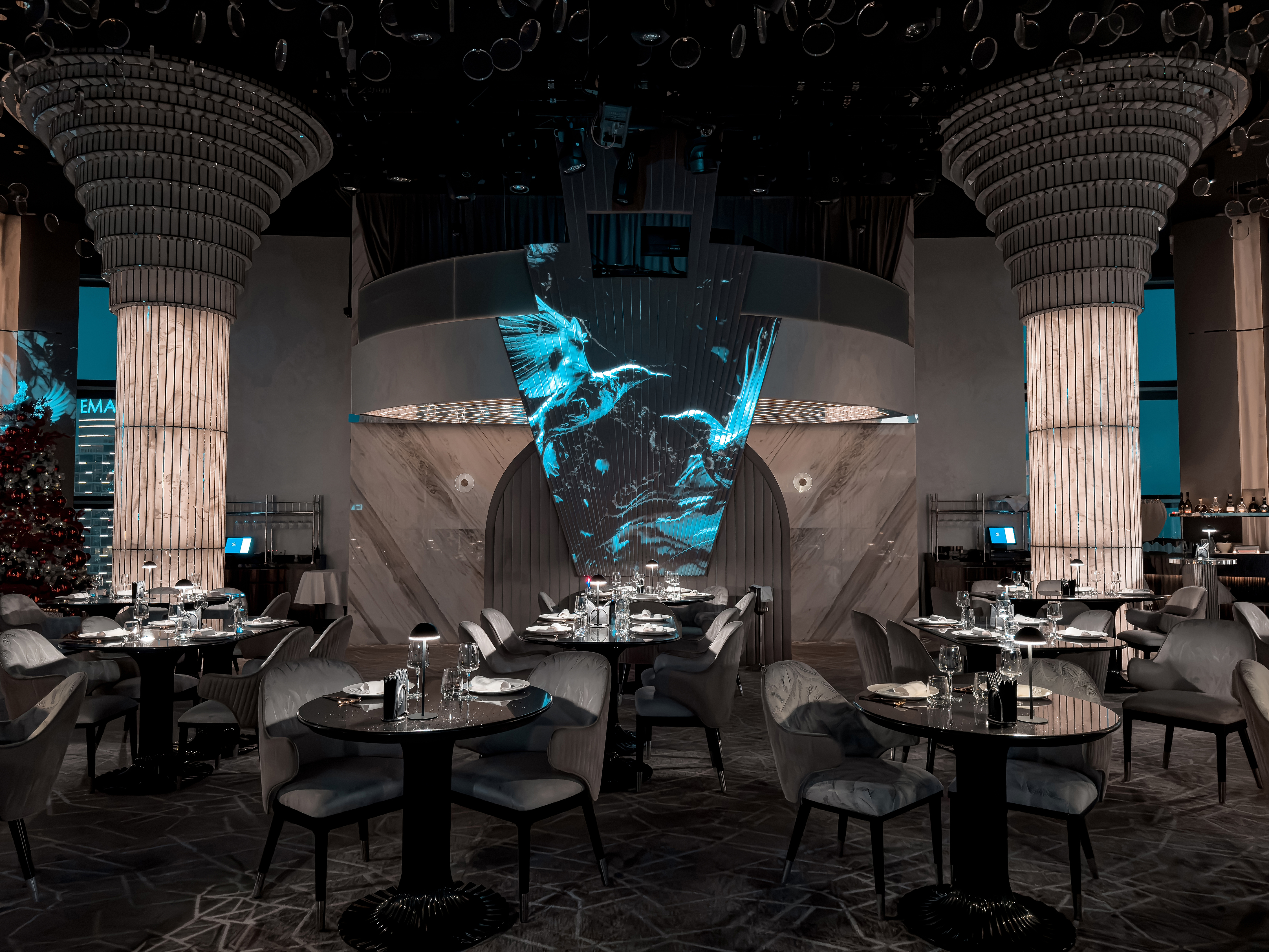 BIRDS Dubai dining room with digital entertainment wall.