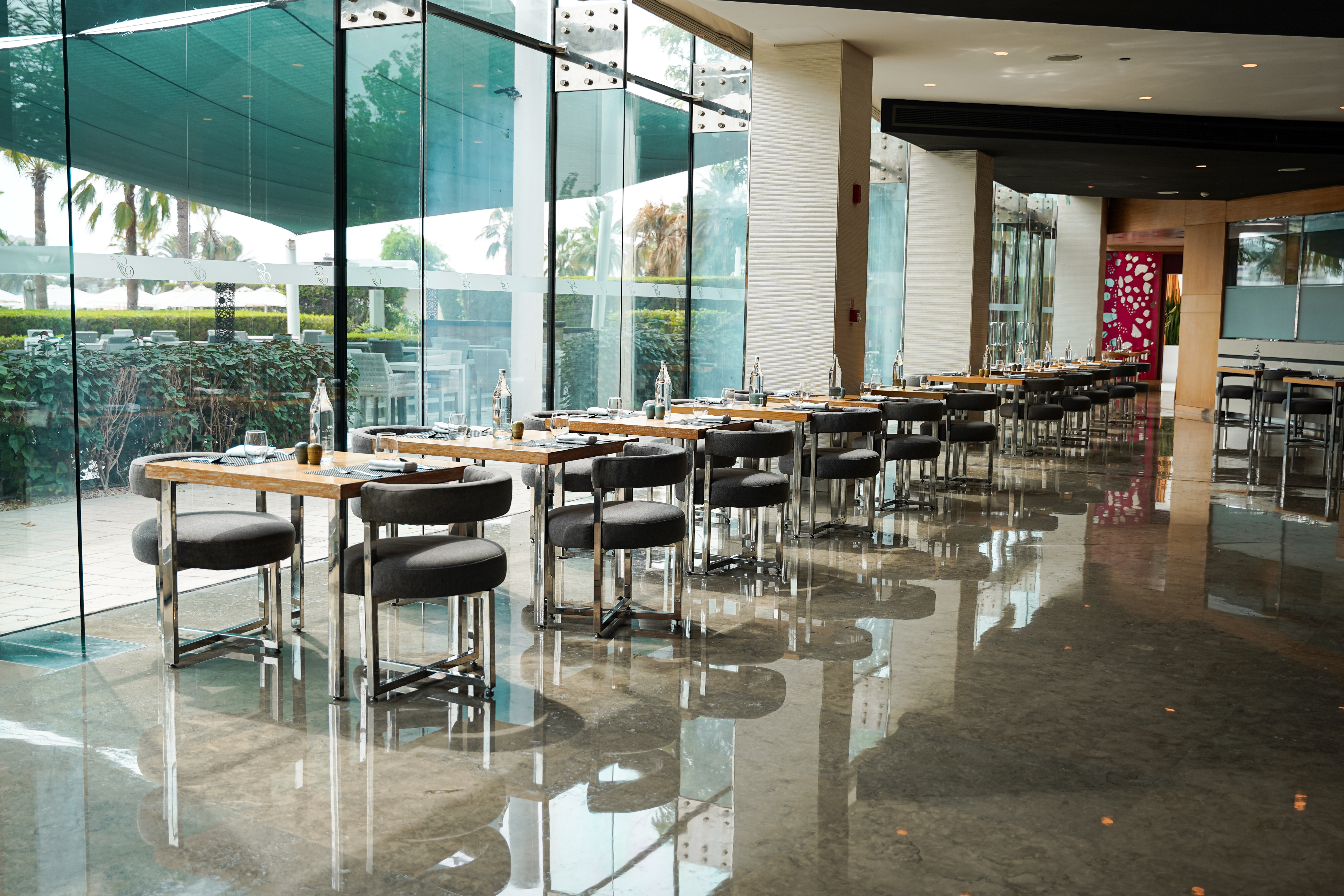 Glass-fronted dining space at Fairmont Bab Al Bahr.