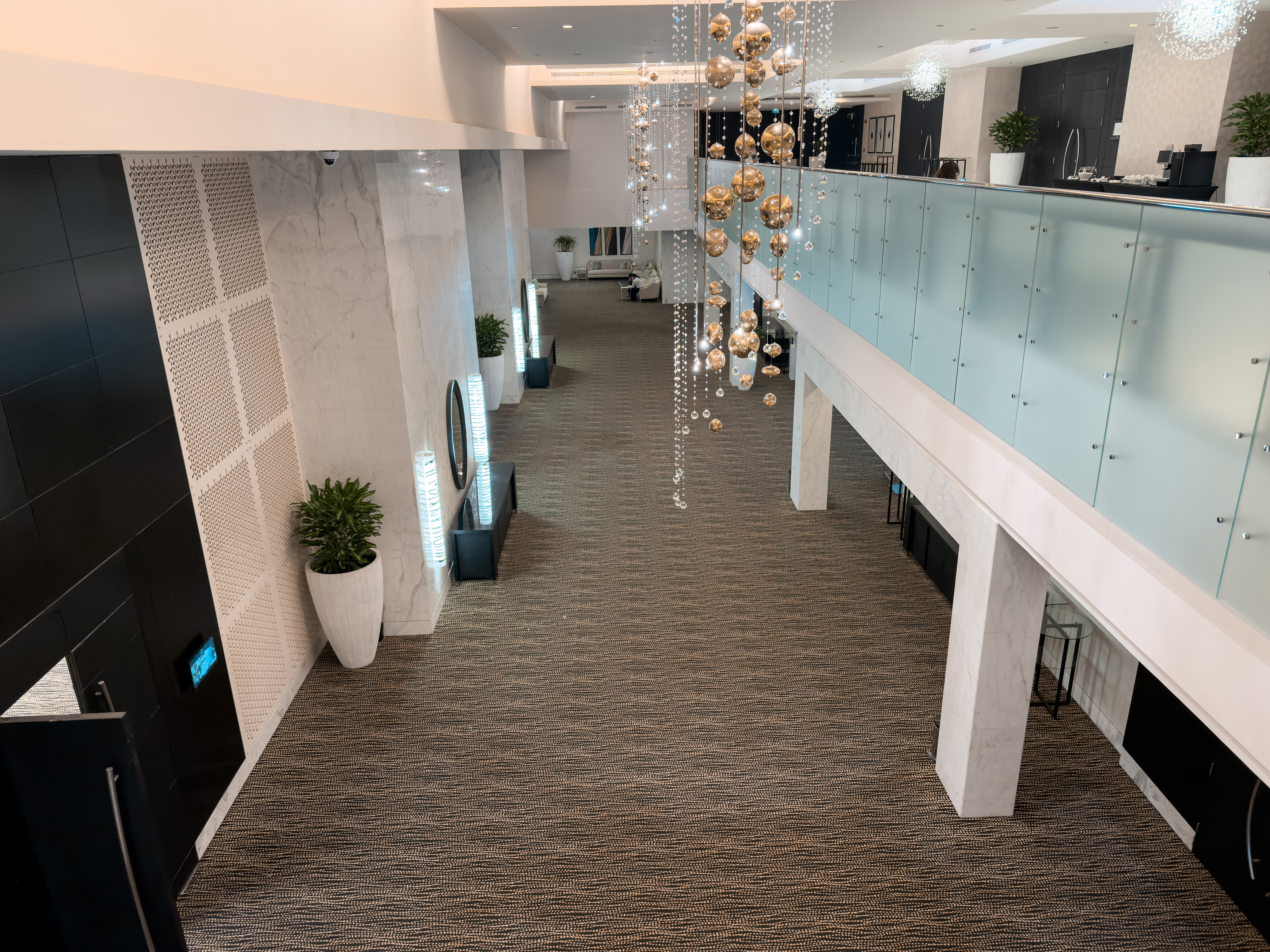 Pre-function hall and balcony area at Sofitel Abu Dhabi Corniche.