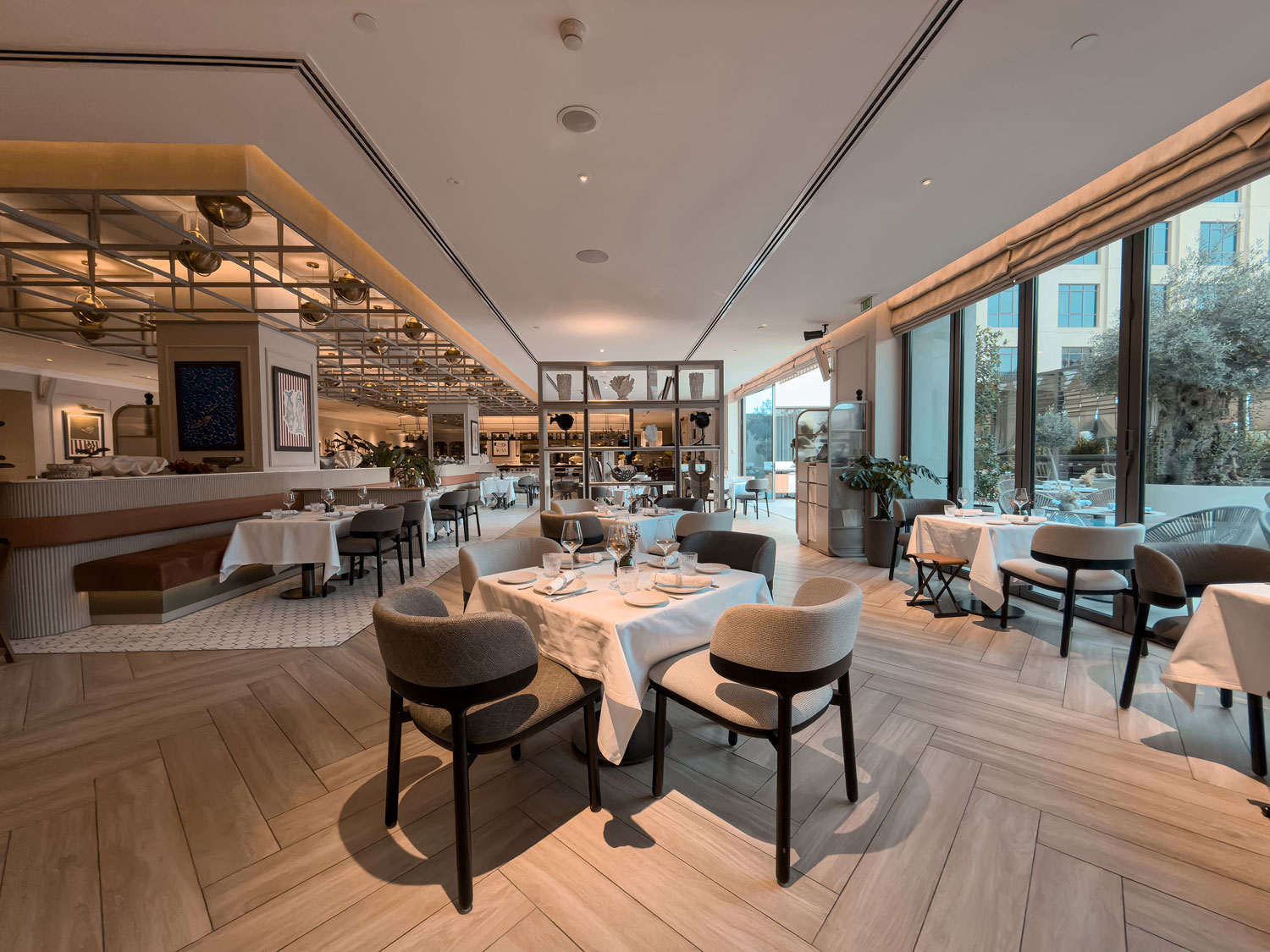 Vera Versilia dining room with tables set for service.